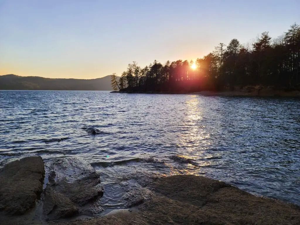 A lakefront view at sunset at Devils Fork State Park
