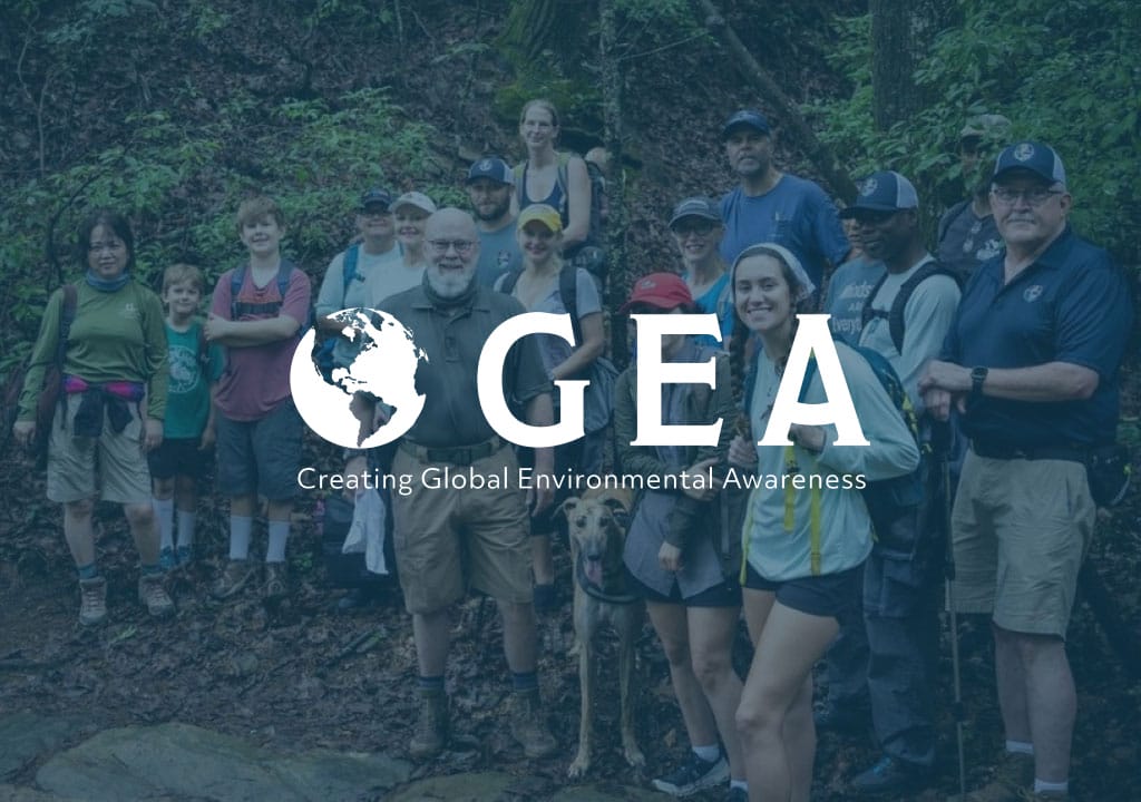 GEA logo (Creating Global Environmental Awareness) set on a photo of the SC7 core team